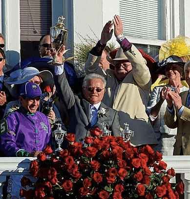 Trainer Art Sherman, jockey Victor Espinoza and owners celebrate after California Chrome wins the 2014 Kentucky Derby